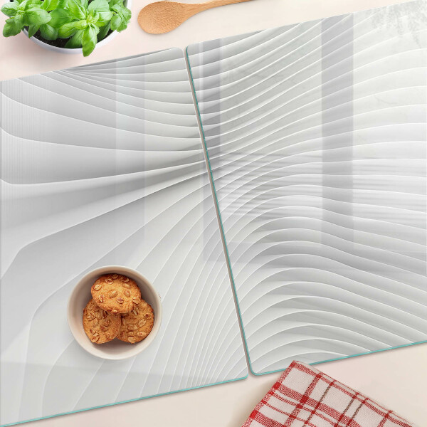 Tagliere in vetro temperato con motivo a onde e linee nei toni del grigio