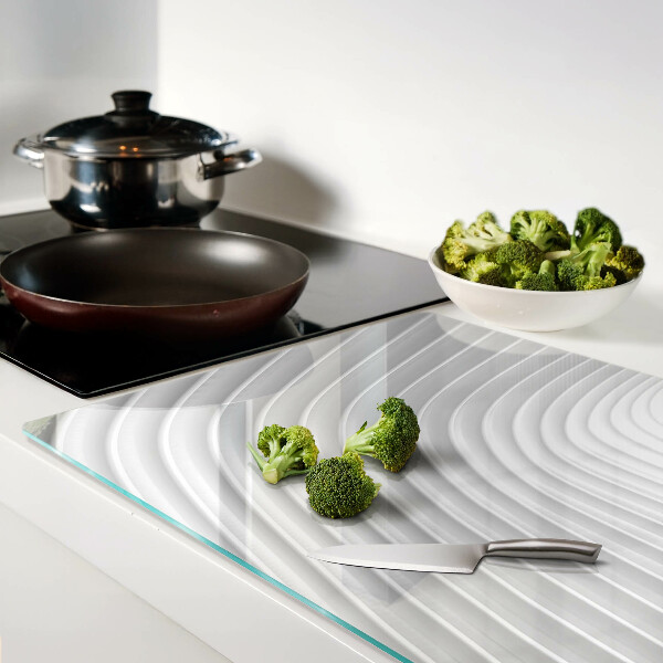 Tagliere in vetro con motivo a onde e linee nei toni del grigio