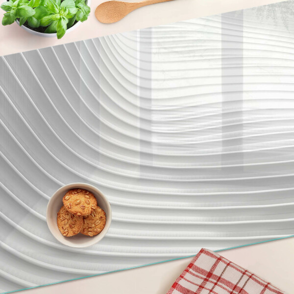 Tagliere in vetro con motivo a onde e linee nei toni del grigio