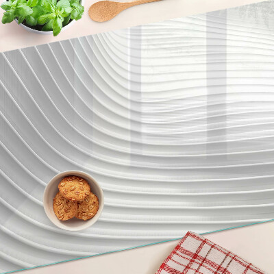 Tagliere in vetro con motivo a onde e linee nei toni del grigio