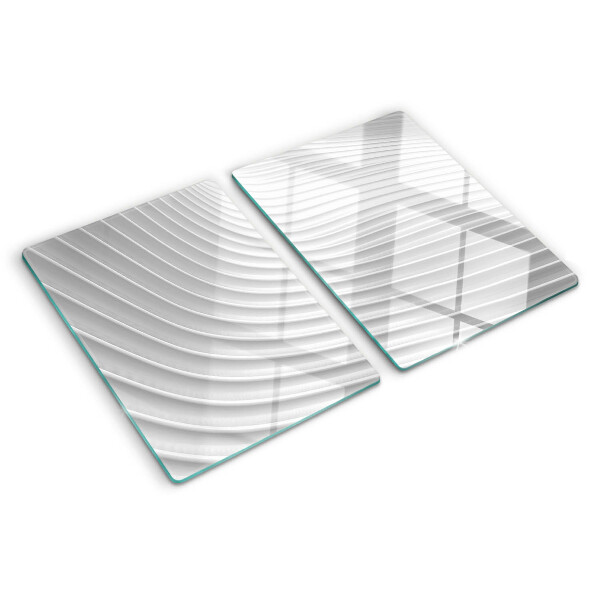Tagliere in vetro con motivo a onde e linee nei toni del grigio