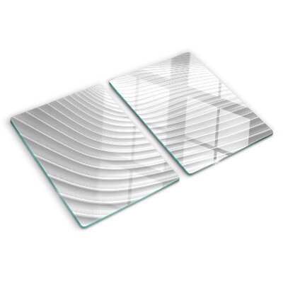 Tagliere in vetro con motivo a onde e linee nei toni del grigio