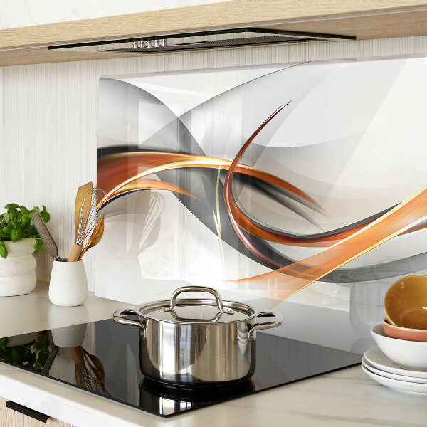 Tagliere in vetro con motivo a onde astratte nei toni dell'oro