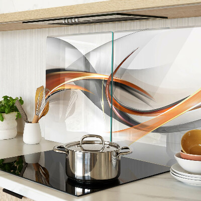 Tagliere in vetro con motivo a onde astratte nei toni dell'oro