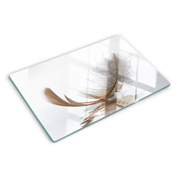 Tagliere in vetro temperato con decoro a piuma su sfondo acqua