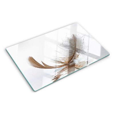 Tagliere in vetro temperato con decoro a piuma su sfondo acqua