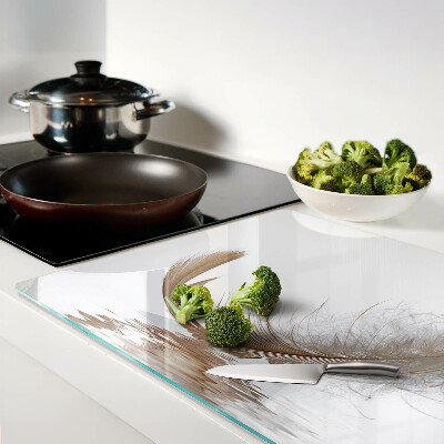 Tagliere in vetro temperato con decoro a piuma su sfondo acqua