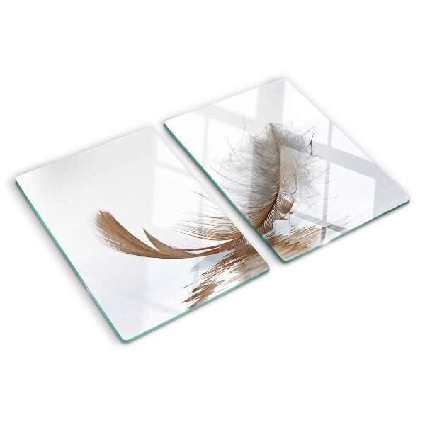 Tagliere in vetro temperato con decoro a piuma su sfondo acqua