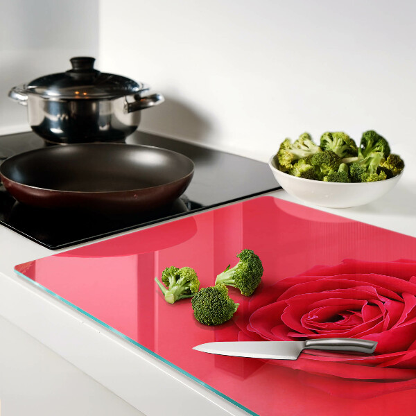 Tagliere in vetro con motivo di rosa rossa sullo sfondo