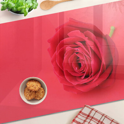 Tagliere in vetro con motivo di rosa rossa sullo sfondo