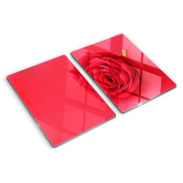 Tagliere in vetro con motivo di rosa rossa sullo sfondo