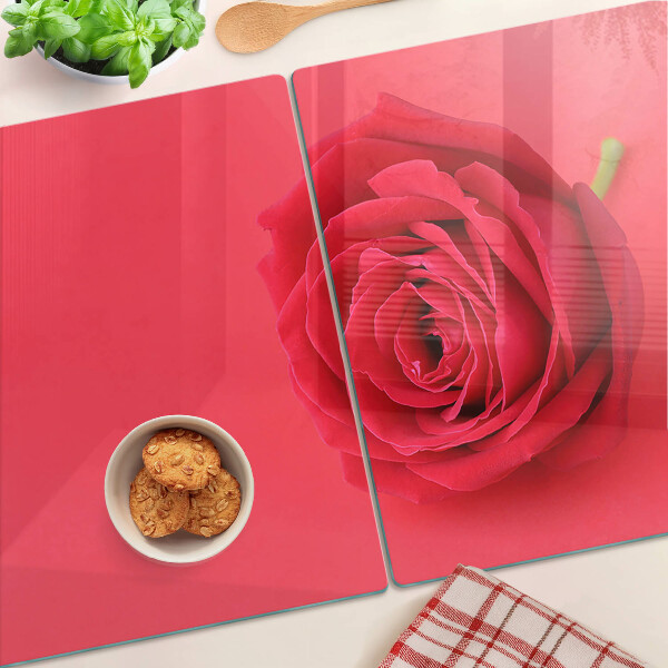 Tagliere in vetro con motivo di rosa rossa sullo sfondo