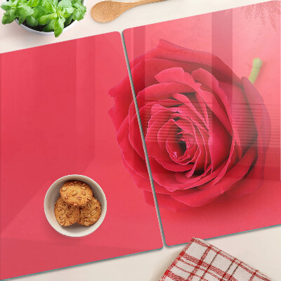 Tagliere in vetro con motivo di rosa rossa sullo sfondo