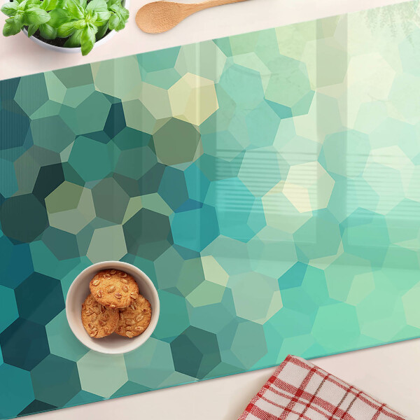 Tagliere in vetro temperato con motivo a esagoni nei toni dell'azzurro