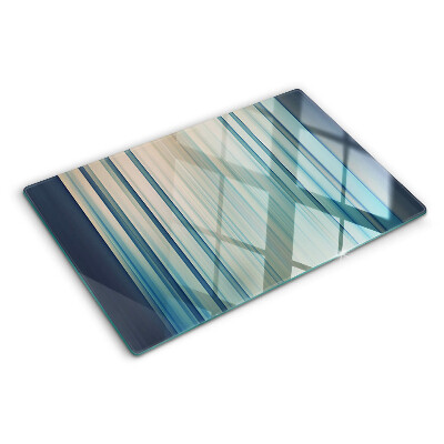 Tagliere in vetro con motivo a linee astratte nei toni del blu