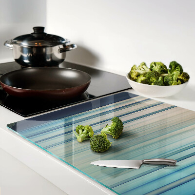 Tagliere in vetro con motivo a linee astratte nei toni del blu