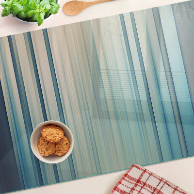 Tagliere in vetro con motivo a linee astratte nei toni del blu