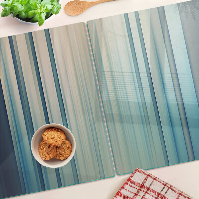 Tagliere in vetro con motivo a linee astratte nei toni del blu