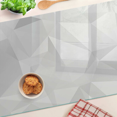 Tagliere in vetro con motivo geometrico nei toni del grigio