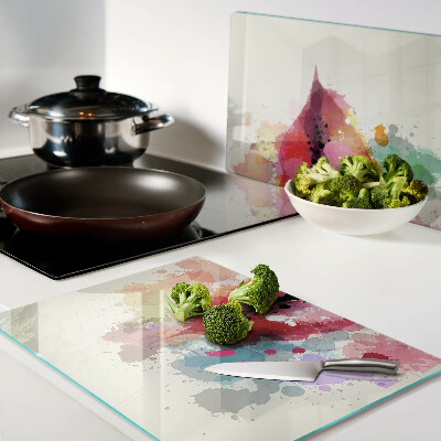 Tagliere in vetro temperato con bordo decorato con macchie colorate