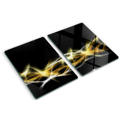 Tagliere in vetro con motivo a onda di luce nei toni dell'oro