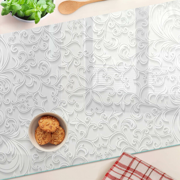 Tagliere in vetro temperato con motivo floreale e dettagli ondulati