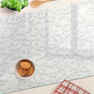 Tagliere in vetro temperato con motivo floreale e dettagli ondulati