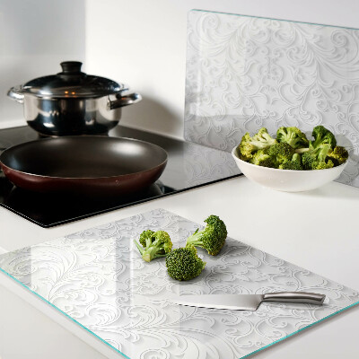 Tagliere in vetro temperato con motivo floreale e dettagli ondulati