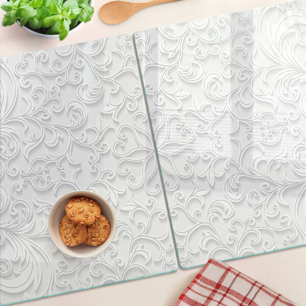 Tagliere in vetro temperato con motivo floreale e dettagli ondulati