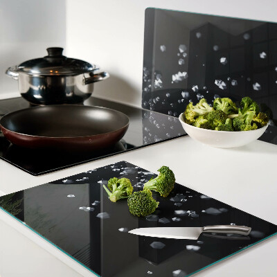 Tagliere in vetro temperato con motivo di bolle di cristallo su sfondo nero