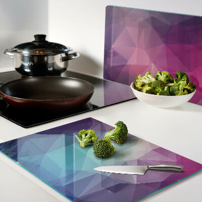 Tagliere in vetro con motivo geometrico nei toni del rosa e del blu