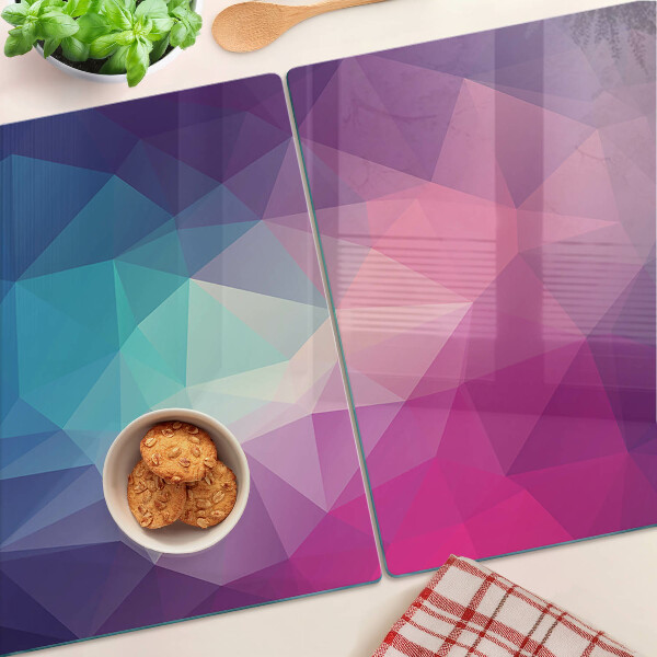 Tagliere in vetro con motivo geometrico nei toni del rosa e del blu