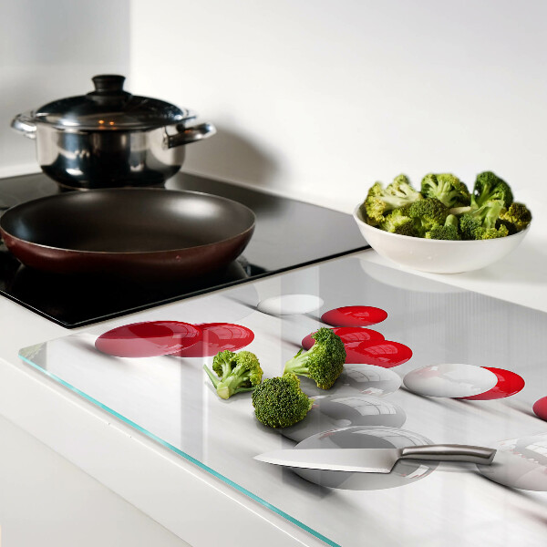 Tagliere in vetro temperato con motivo a sfere rosse e bianche