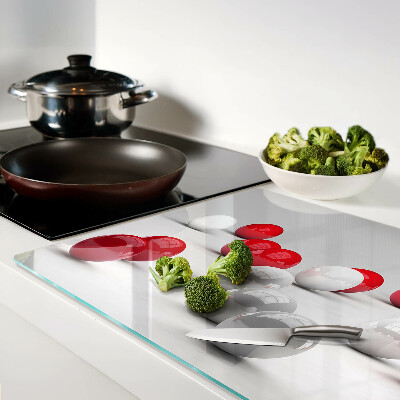 Tagliere in vetro temperato con motivo a sfere rosse e bianche