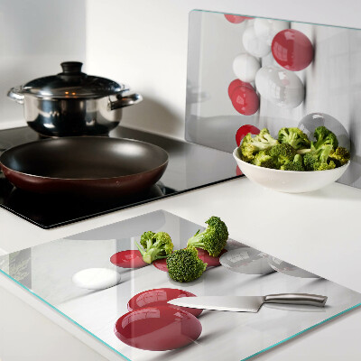 Tagliere in vetro temperato con motivo a sfere rosse e bianche