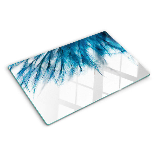 Tagliere in vetro Piume blu su sfondo bianco