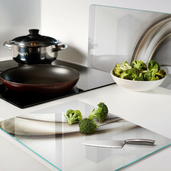 Tagliere in vetro temperato con motivo a onde nei toni del beige