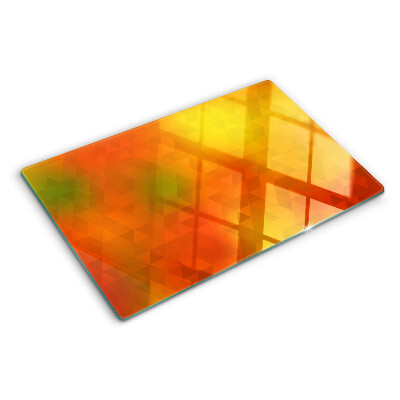 Tagliere in vetro con motivo geometrico nei toni dell'arancione