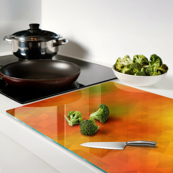 Tagliere in vetro con motivo geometrico nei toni dell'arancione