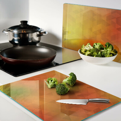 Tagliere in vetro con motivo geometrico nei toni dell'arancione