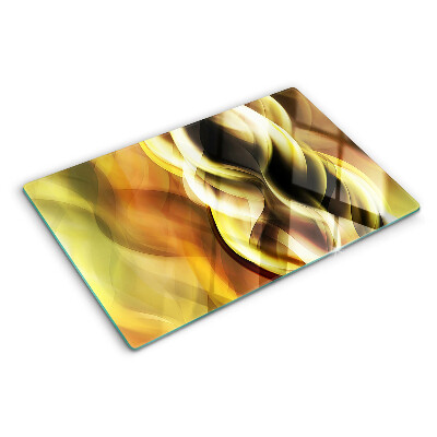 Tagliere in vetro con decorazione a onde astratte nei toni dell'oro