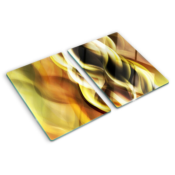 Tagliere in vetro con decorazione a onde astratte nei toni dell'oro