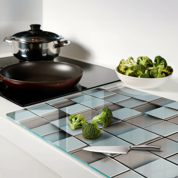 Tagliere in vetro temperato con motivo a piastrelle geometriche nei toni del blu