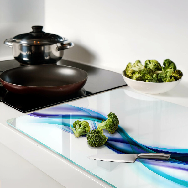 Tagliere in vetro temperato con decorazione a onde nei toni del blu e turchese