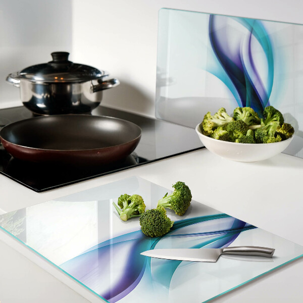 Tagliere in vetro temperato con decorazione a onde nei toni del blu e turchese