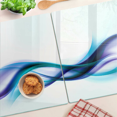 Tagliere in vetro temperato con decorazione a onde nei toni del blu e turchese