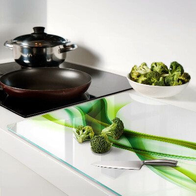 Tagliere in vetro con motivo a onde nei toni del verde