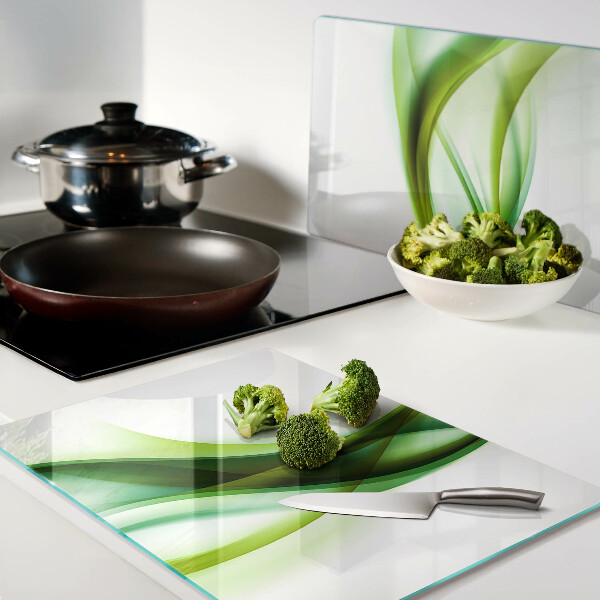 Tagliere in vetro con motivo a onde nei toni del verde