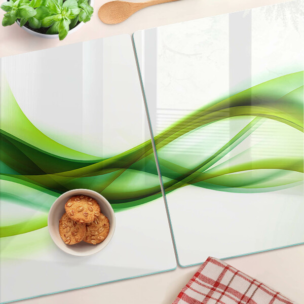 Tagliere in vetro con motivo a onde nei toni del verde