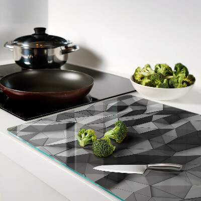 Tagliere in vetro con motivo geometrico astratto nei toni del grigio